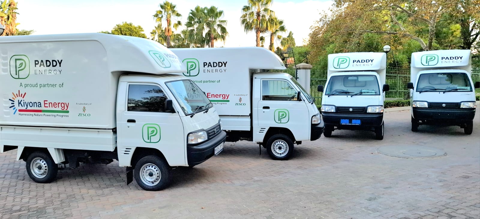Close-up of Paddy Energy branded delivery vehicles
