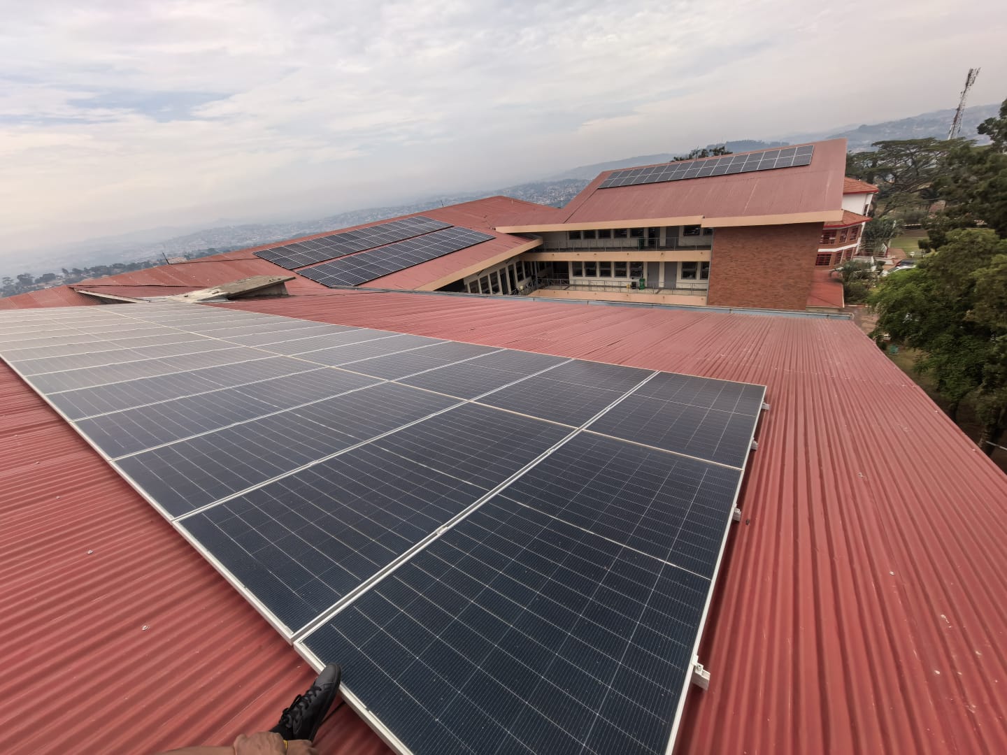 Rooftop solar panel installation overlooking the city